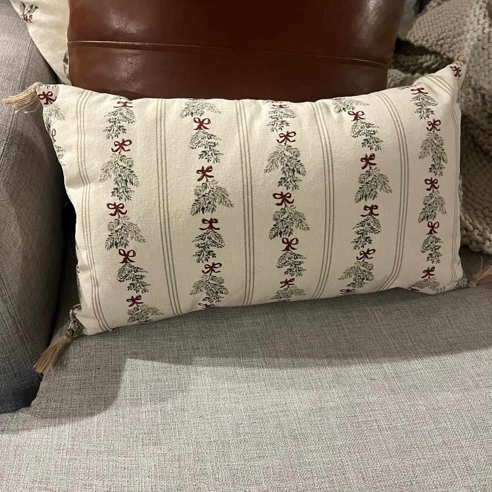 Red and Green Holiday Pillow with Vertical Stripes and Floral Motif